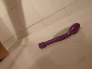 Brunette masturbates on the shower